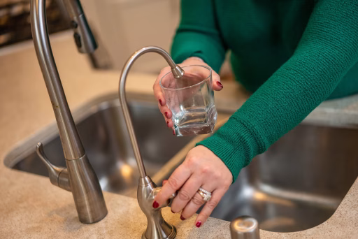 filling water glass from kinetico drinking water faucet