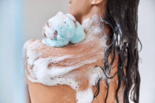 woman in shower with rich soap lather bubbles