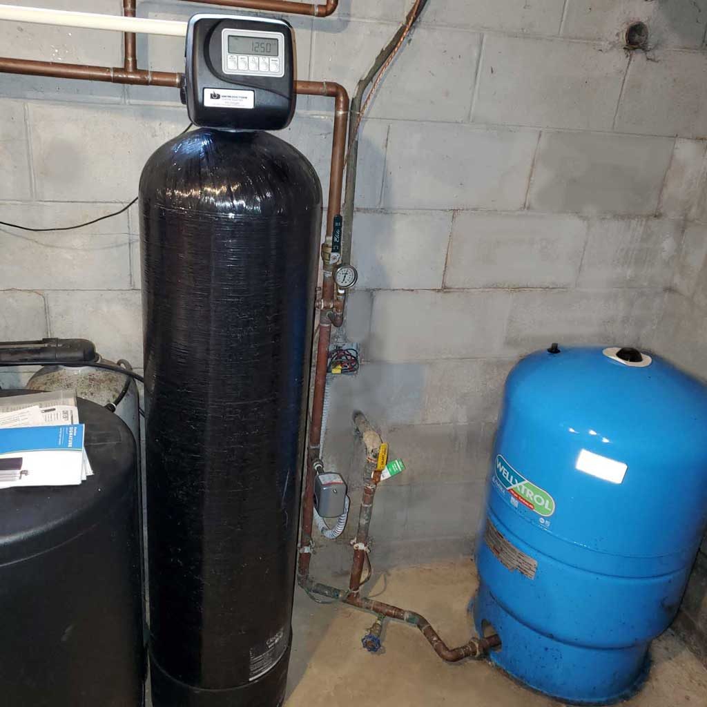 Well water filter system installed in a home's basement
